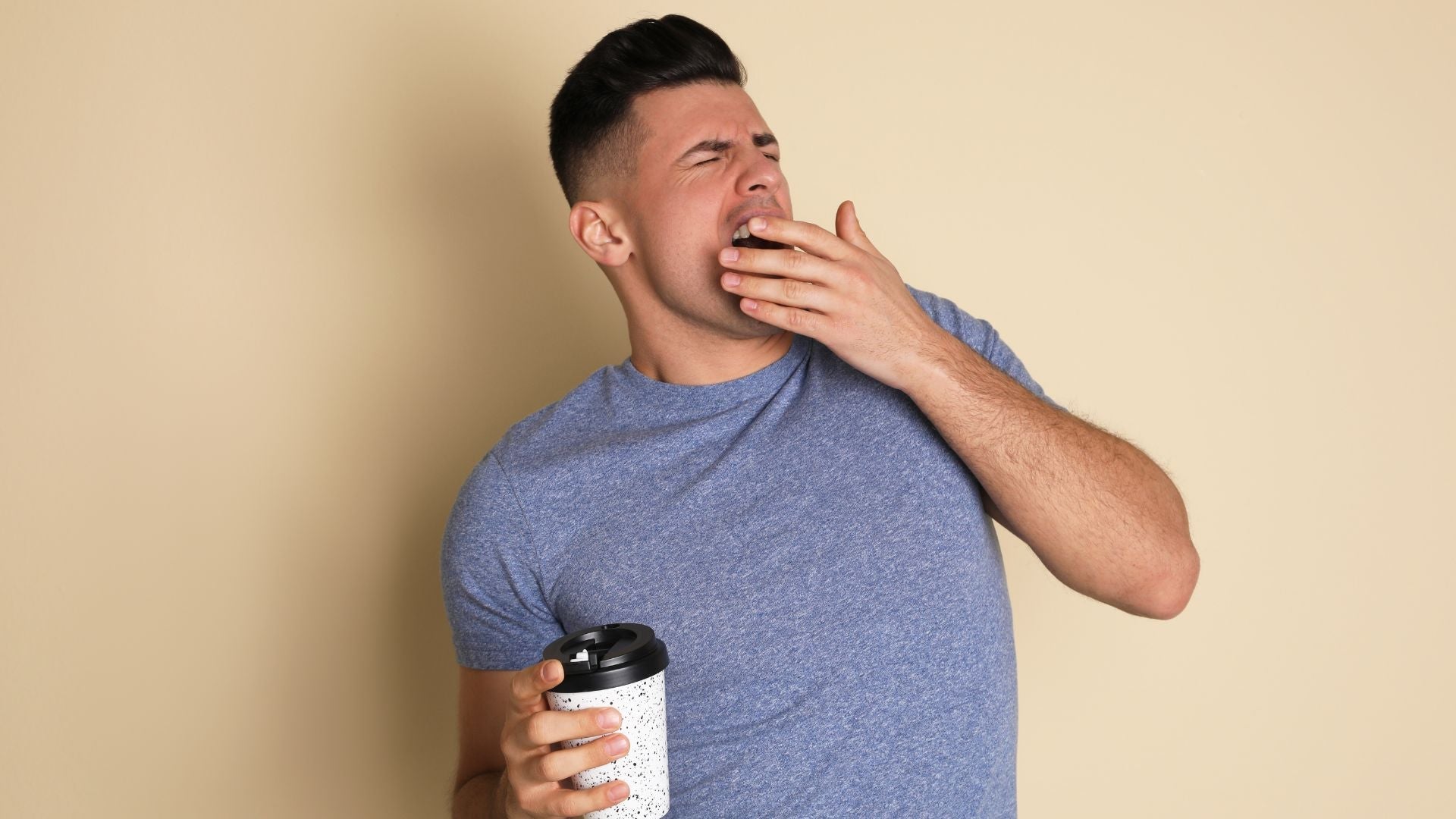 man yawning. still tired, not enough sleep