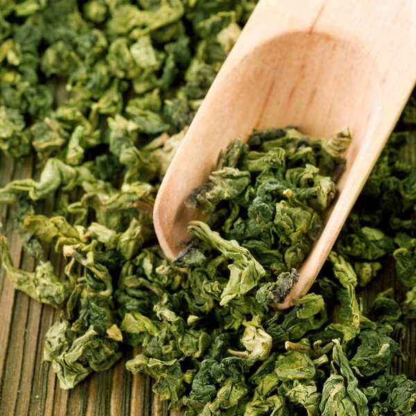 close up of green tea leaves catechins
