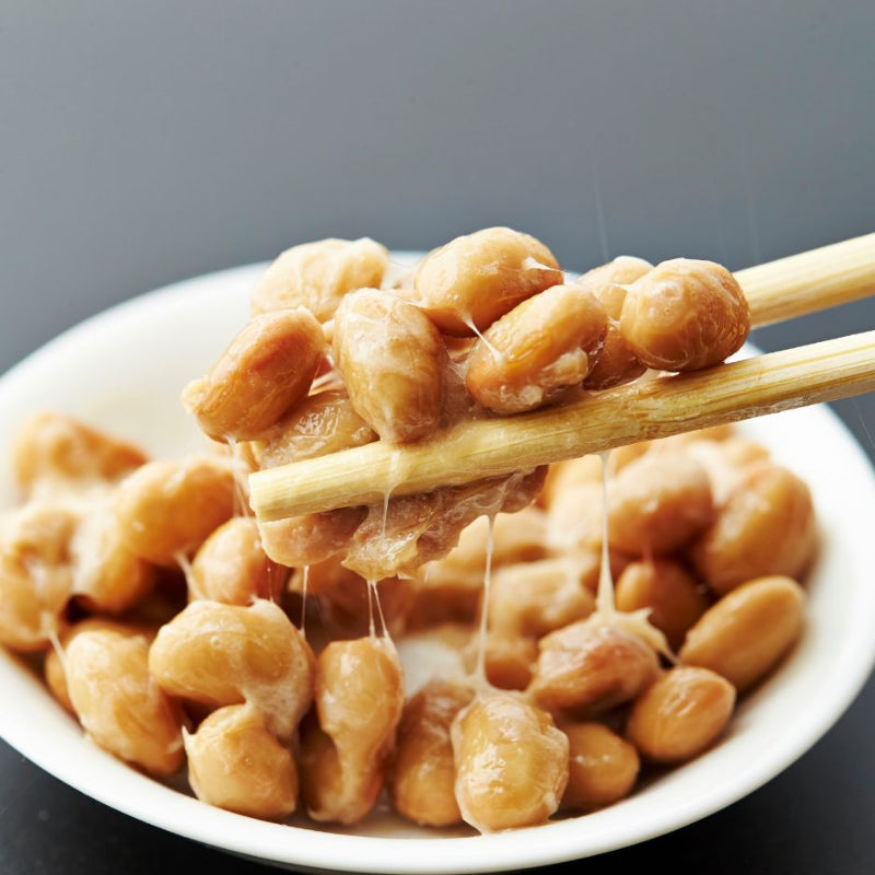 natto dish and chopsticks close up view